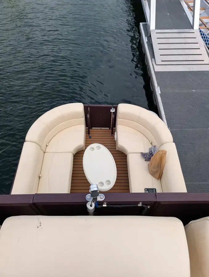 Bow seating area with table on the pontoon boat